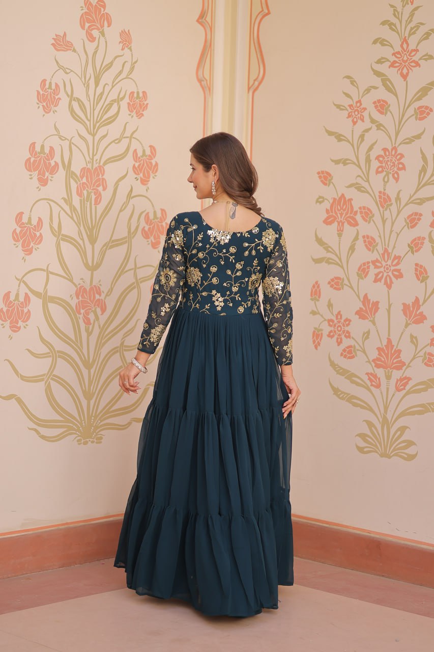 Back view of green gown with full sleeves and zari
