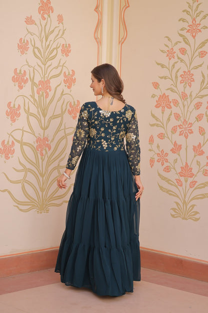 Back view of green gown with full sleeves and zari
