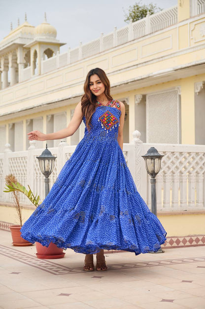 Close-up of royal blue Bandhani gown with vibrant Gamathi embroidery and cowrie shell accents.