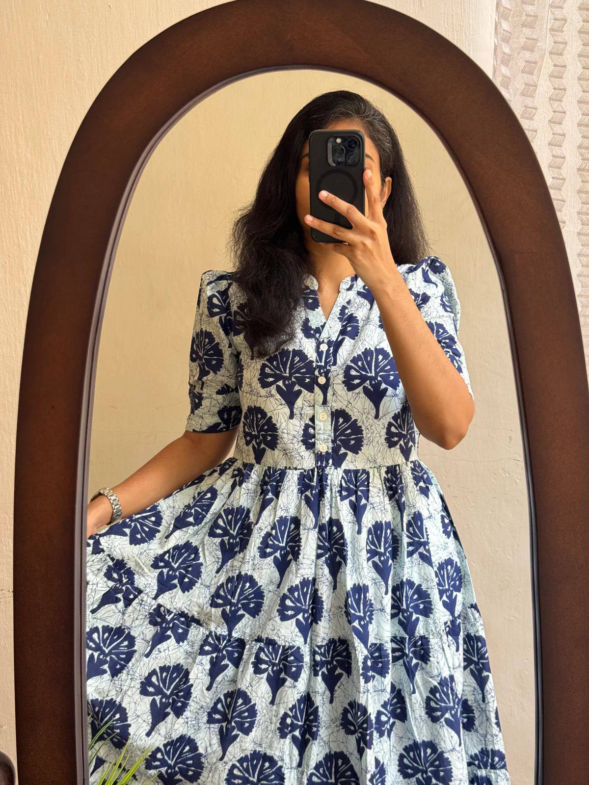 Close-up of floral print cotton maxi dress with button-down front.