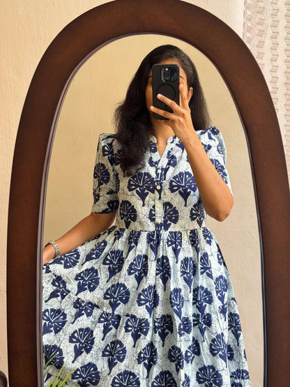 Close-up of floral print cotton maxi dress with button-down front.