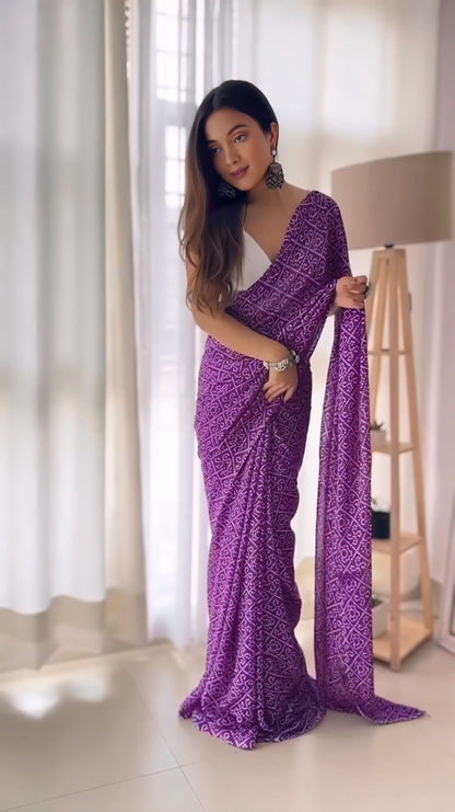 Georgette purple saree with printed design and detailed border