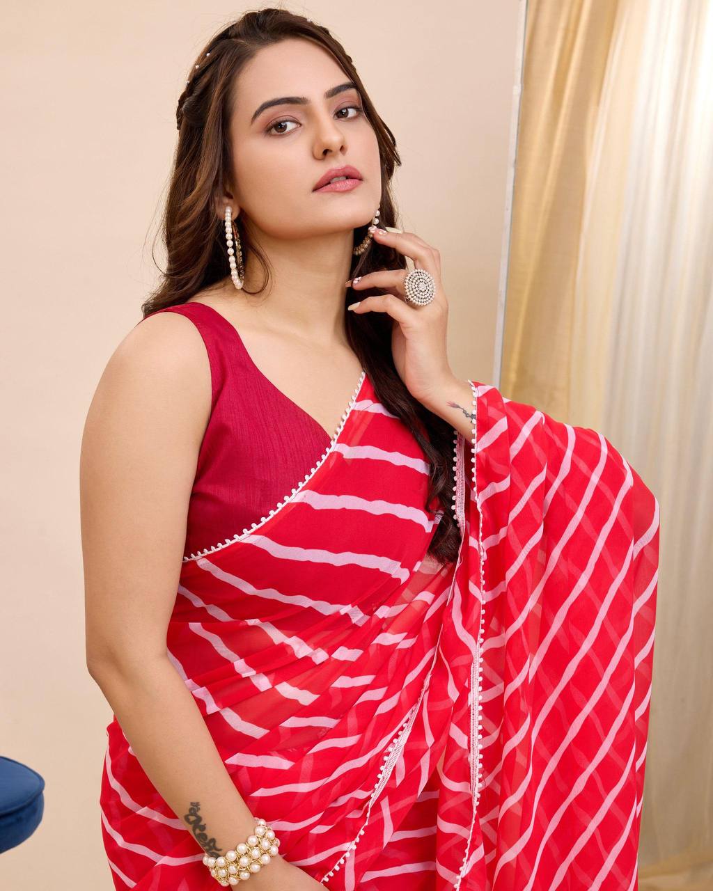 Vibrant red and white leheriya print georgette ready to wear saree.