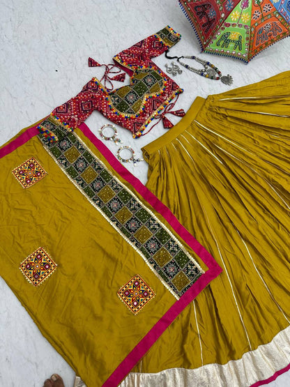 Full cotton lehenga choli set with Gamthi work, pink trim and gold border, laid on floor.