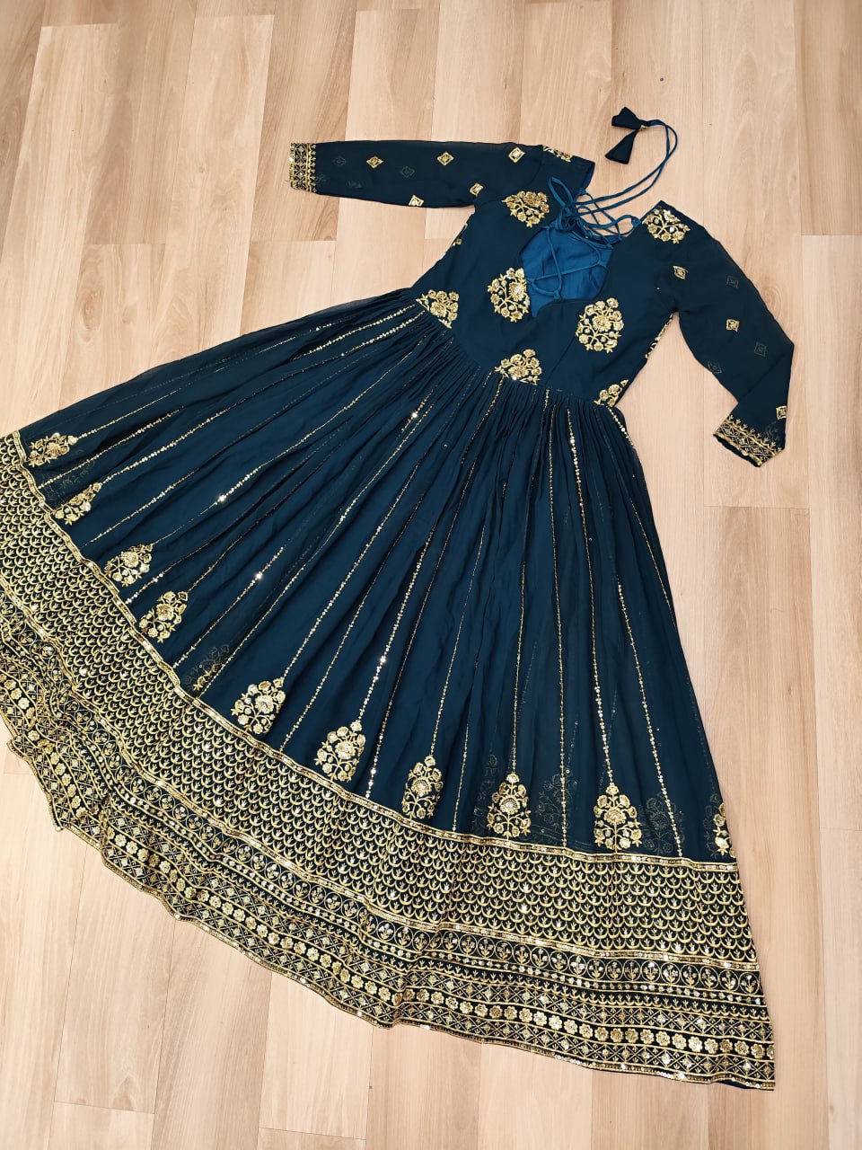 Rama green gown with a 3-meter flair and full zari embroidered border.