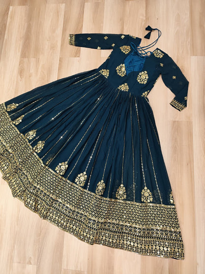 Rama green gown with a 3-meter flair and full zari embroidered border.