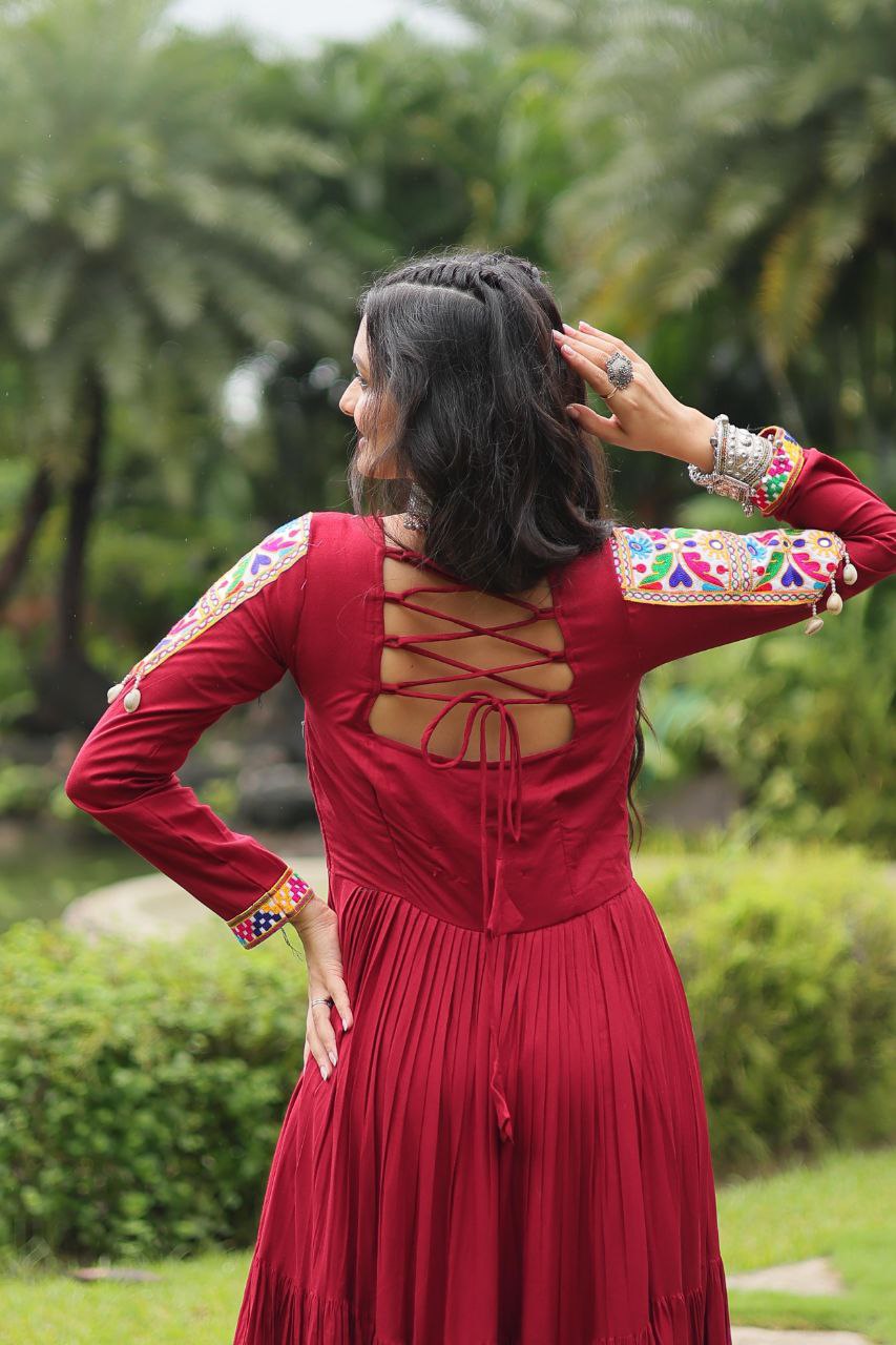 Back view of maroon Gamthi Gown showing stylish tie-up back and Kutchi embroidered sleeves.
