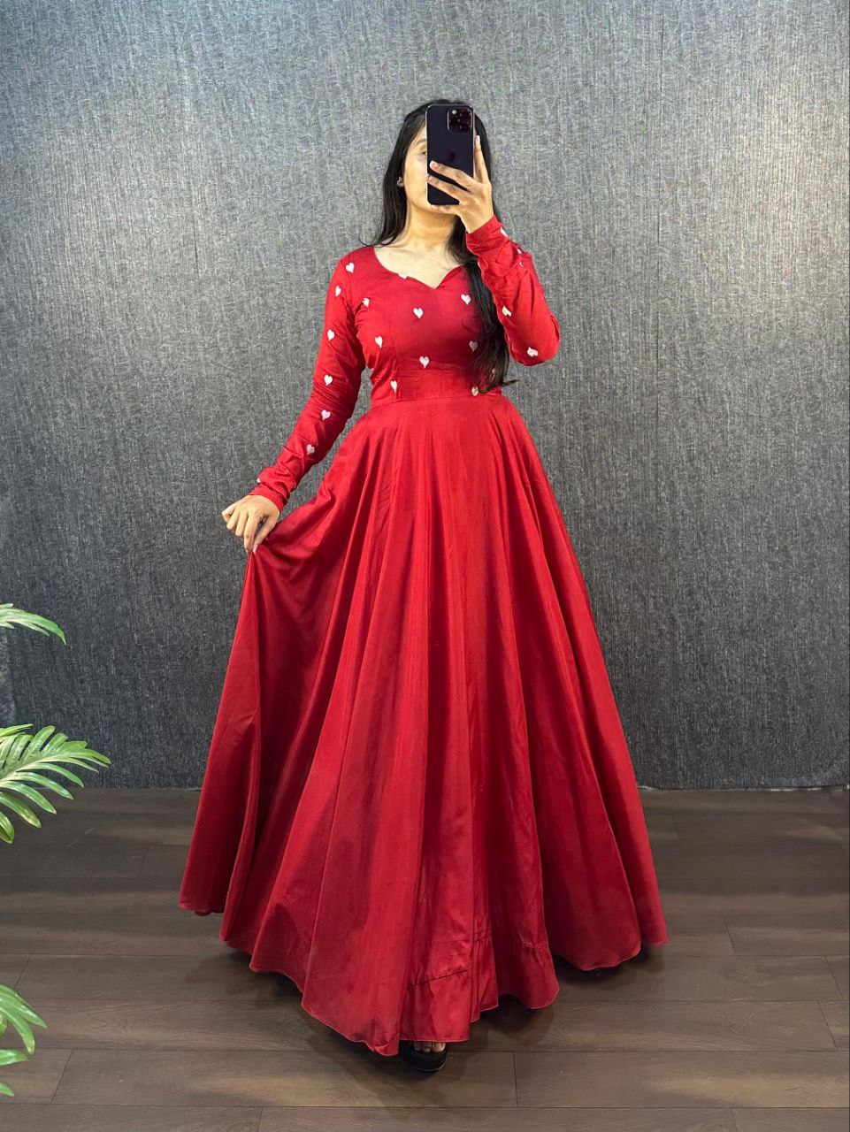 Close-up of the red Ajrak Heart Gown, highlighting the fabric and design.