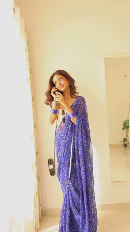 Model in flowing blue georgette saree, enjoying the light and airy fabric.