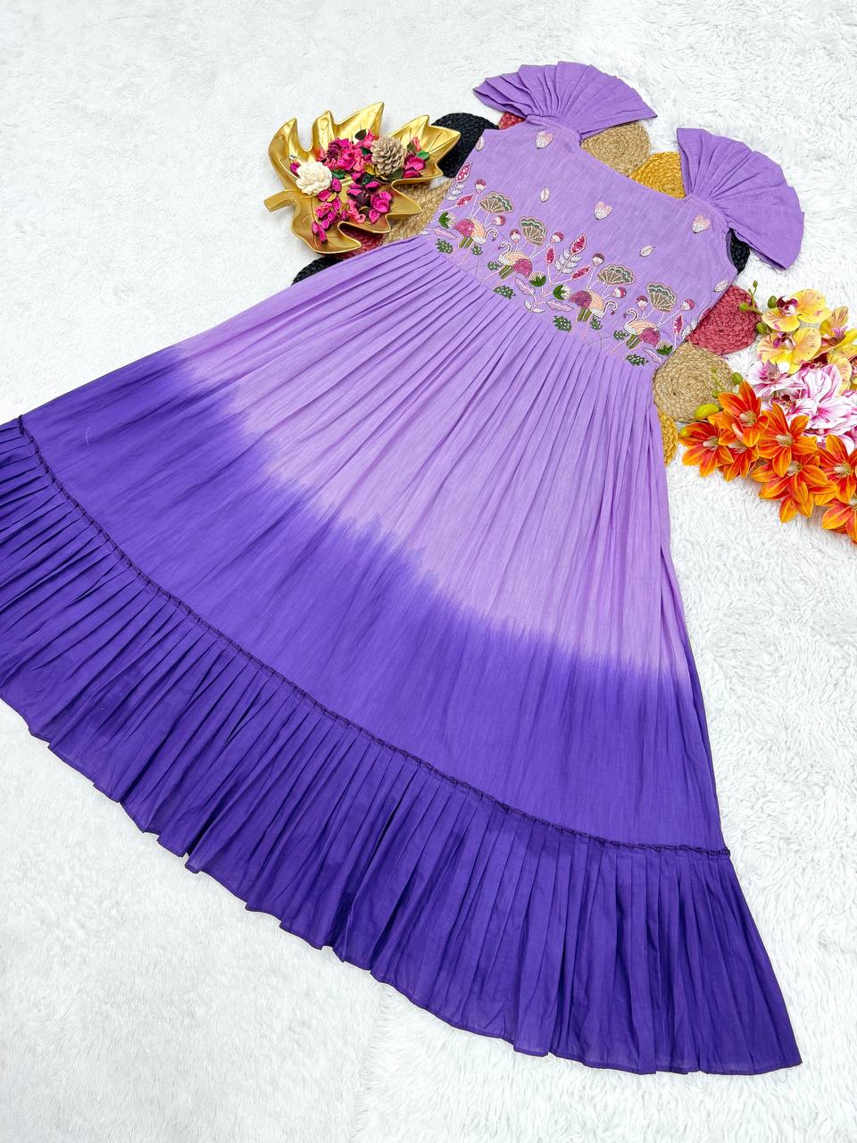 Full overhead shot of the purple and violet gown showing the tiered ruffle and color gradient.