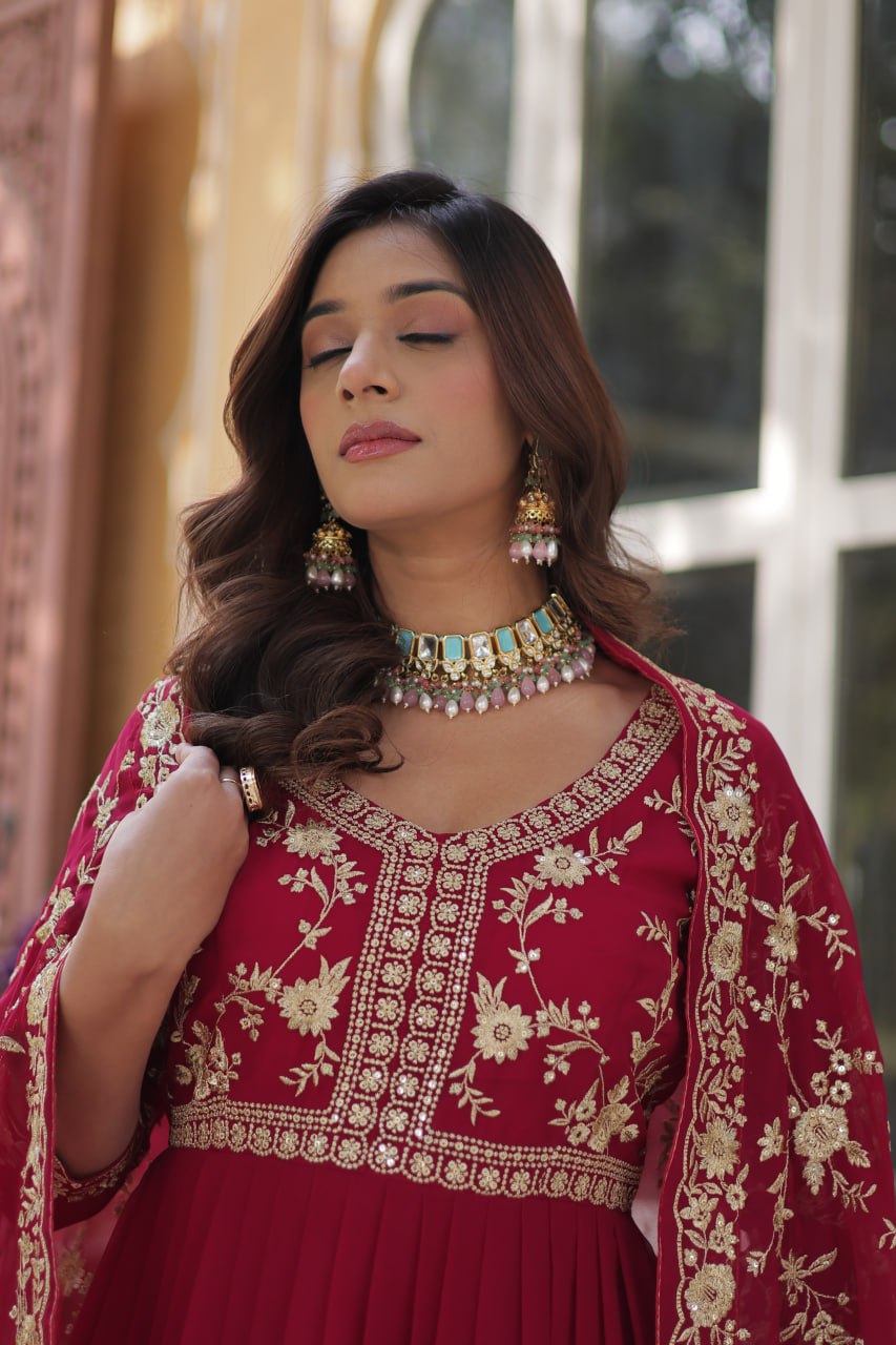 Detailed embroidery on the neckline of the premium pink Indian gown.