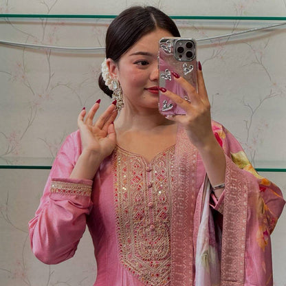 Close up of the embroidered neckline on the pastel pink Anarkali kurta.