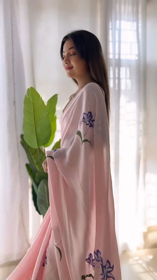 Elegant pink georgette saree featuring a floral print, designed ready-to-wear.