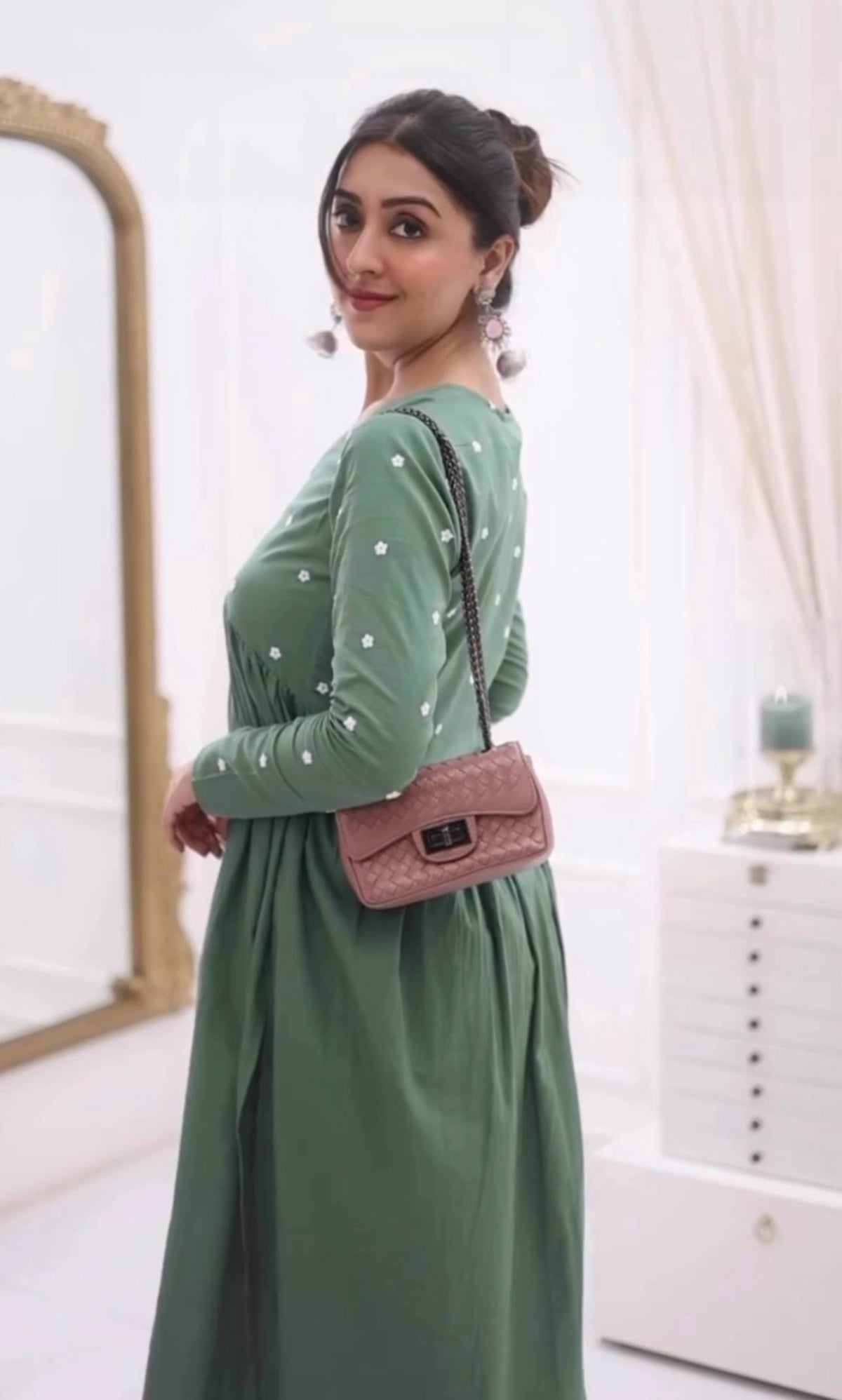 Close-up: Light green Farheen co-ord set with pink purse detail.