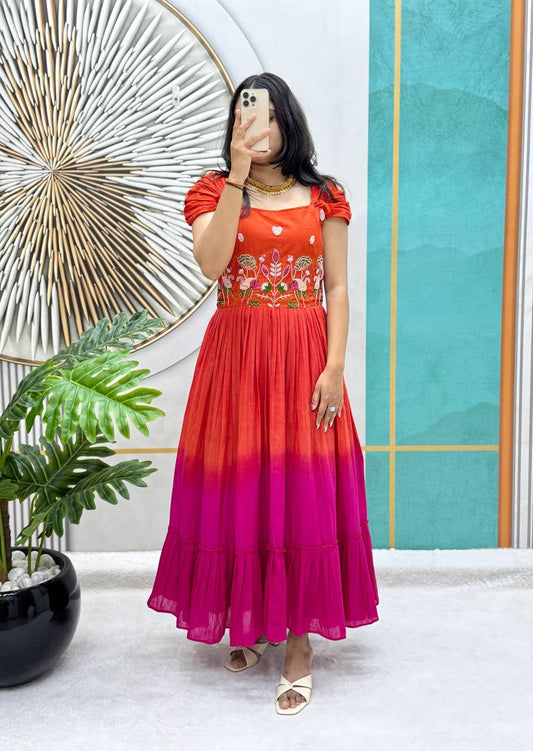 Full view of a orange and pink Festive Elegance Handworked Cotton Gown on a model.