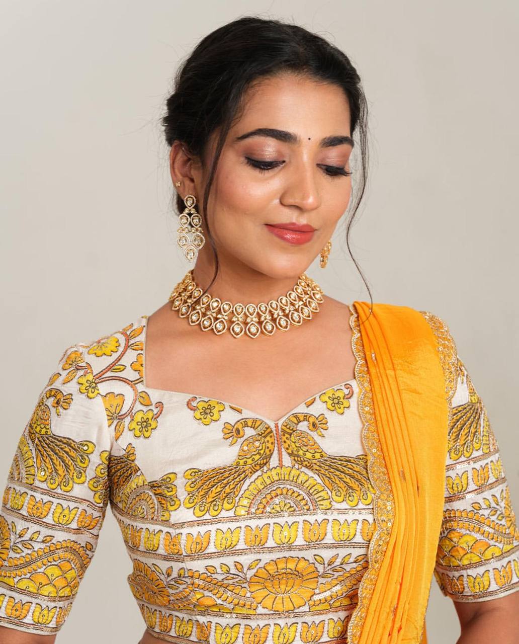Detailed view of Kalamkari print and embroidery on choli.