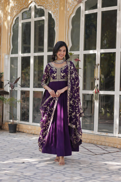 Premium purple gown featuring intricate gold embroidery and flowing dupatta.