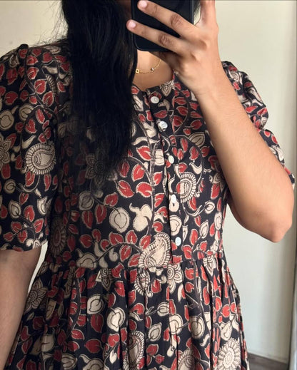 Close-up of the Kalamkari pattern and button detail on the Kalamkari dress.
