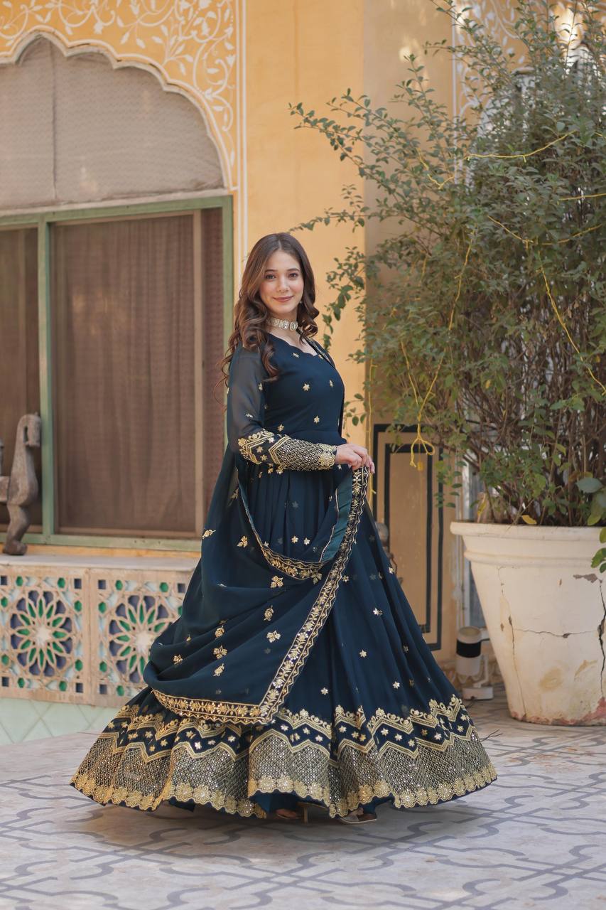 Flowing teal Anarkali gown with full sleeves and matching dupatta, perfect for special occasions.