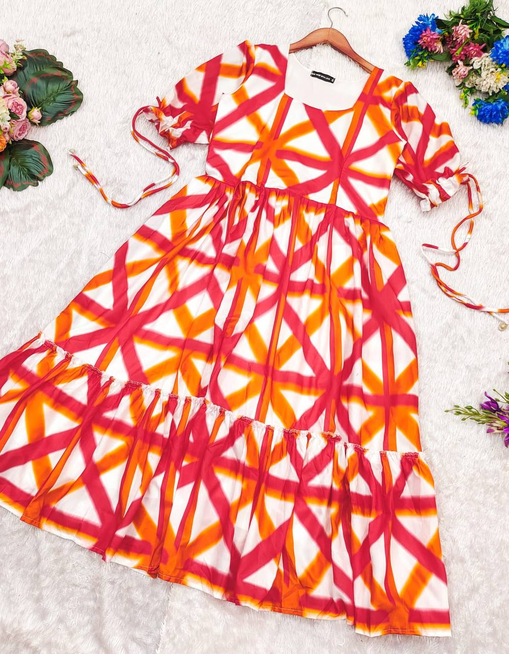 Sajda Maxi Dress in red-orange-white with ruffle hem detail.