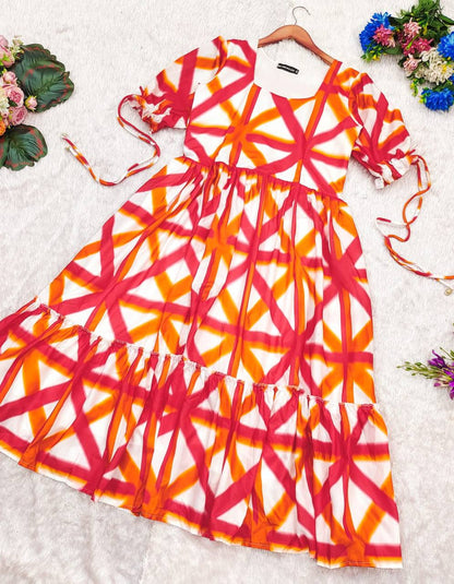 Sajda Maxi Dress in red-orange-white with ruffle hem detail.