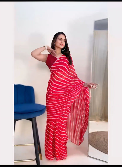 Model showcasing lightweight red georgette saree with leheriya print, perfect for parties and weddings.