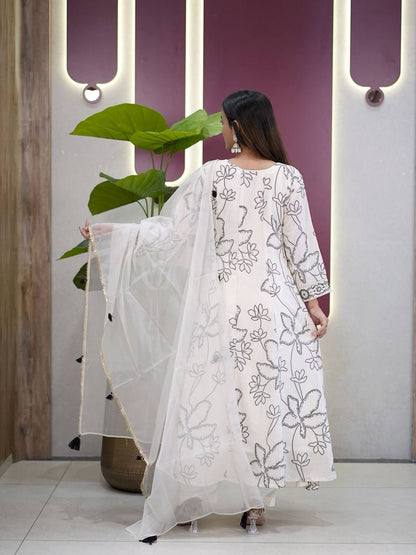Back view of white Anarkali Salwar Suit featuring digital print and tassels on dupatta.