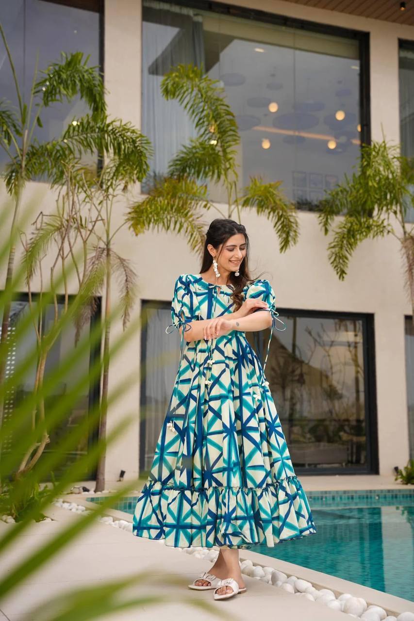 Model in blue-dark blue-white Sajda Maxi Dress with tie sleeves.