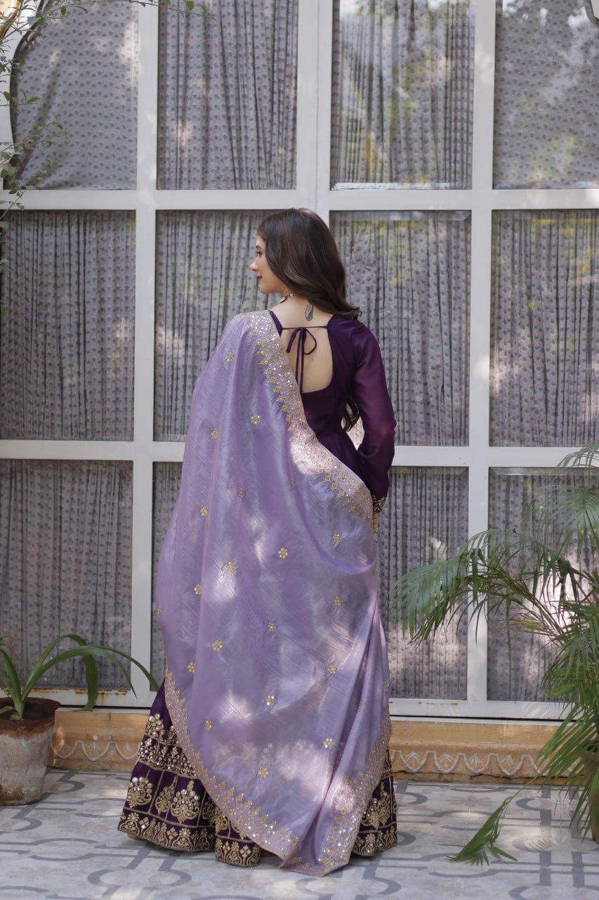 Back of a stylish purple gown with light purple and gold dupatta.