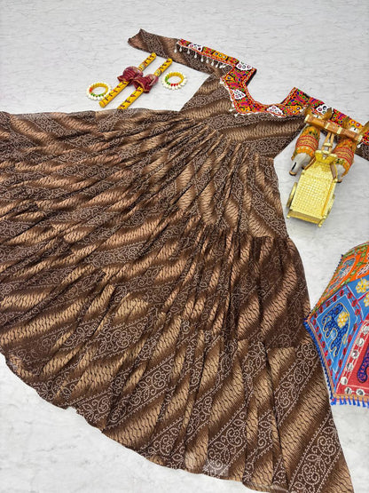 Full brown Bandhni print gown displayed flat, highlighting festive embroidery and accessories.