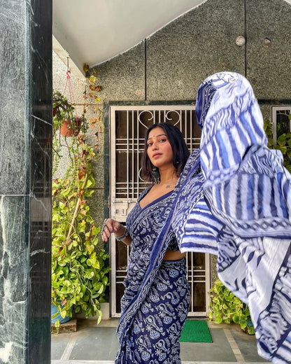 Close-up of woman in comfortable blue and white cotton saree, ready to wear.