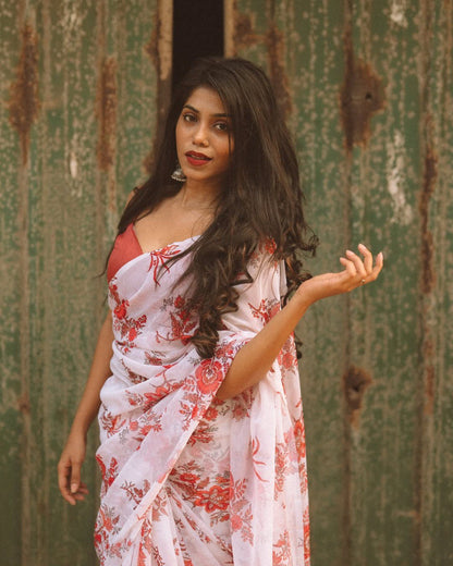 Model showcasing the lightweight georgette fabric and floral design of the saree.