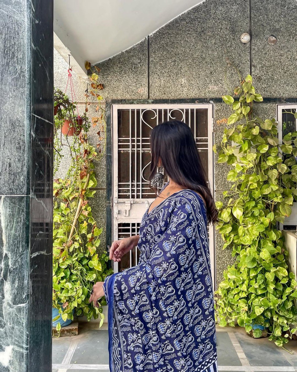 Elegant cotton ready-to-wear saree in blue and white print.