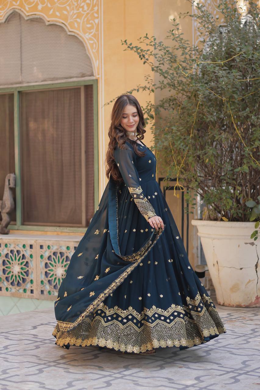 Designer teal Anarkali gown with exquisite zari and sequin detailing. Shop now!