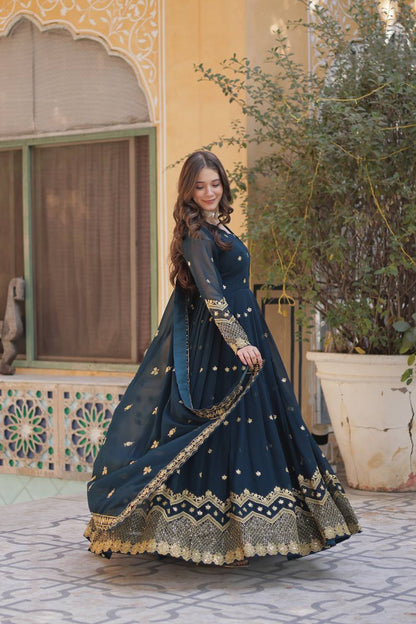 Designer teal Anarkali gown with exquisite zari and sequin detailing. Shop now!