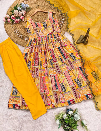 Elegant yellow Anarkali suit set with vibrant prints and sheer dupatta.