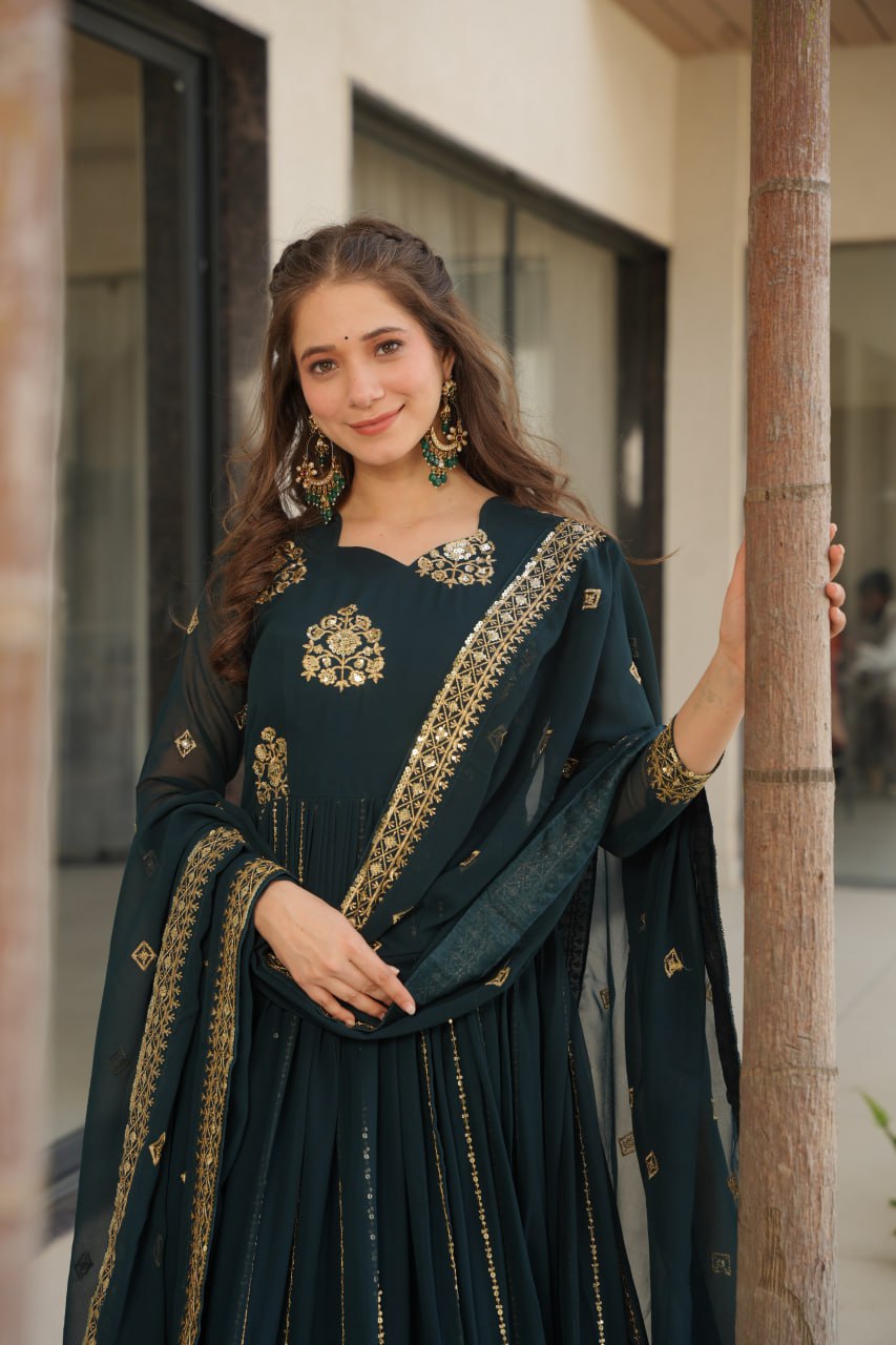 Close-up of a woman wearing a Rama green gown with embroidered dupatta.