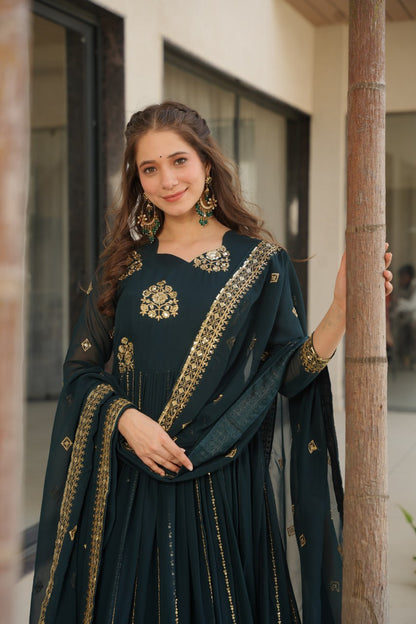 Close-up of a woman wearing a Rama green gown with embroidered dupatta.