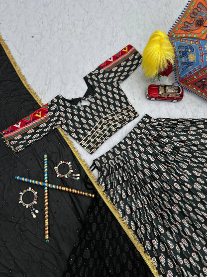 Top view of Gamathi Glam lehenga choli set with embroidered dupatta and Navratri accessories.