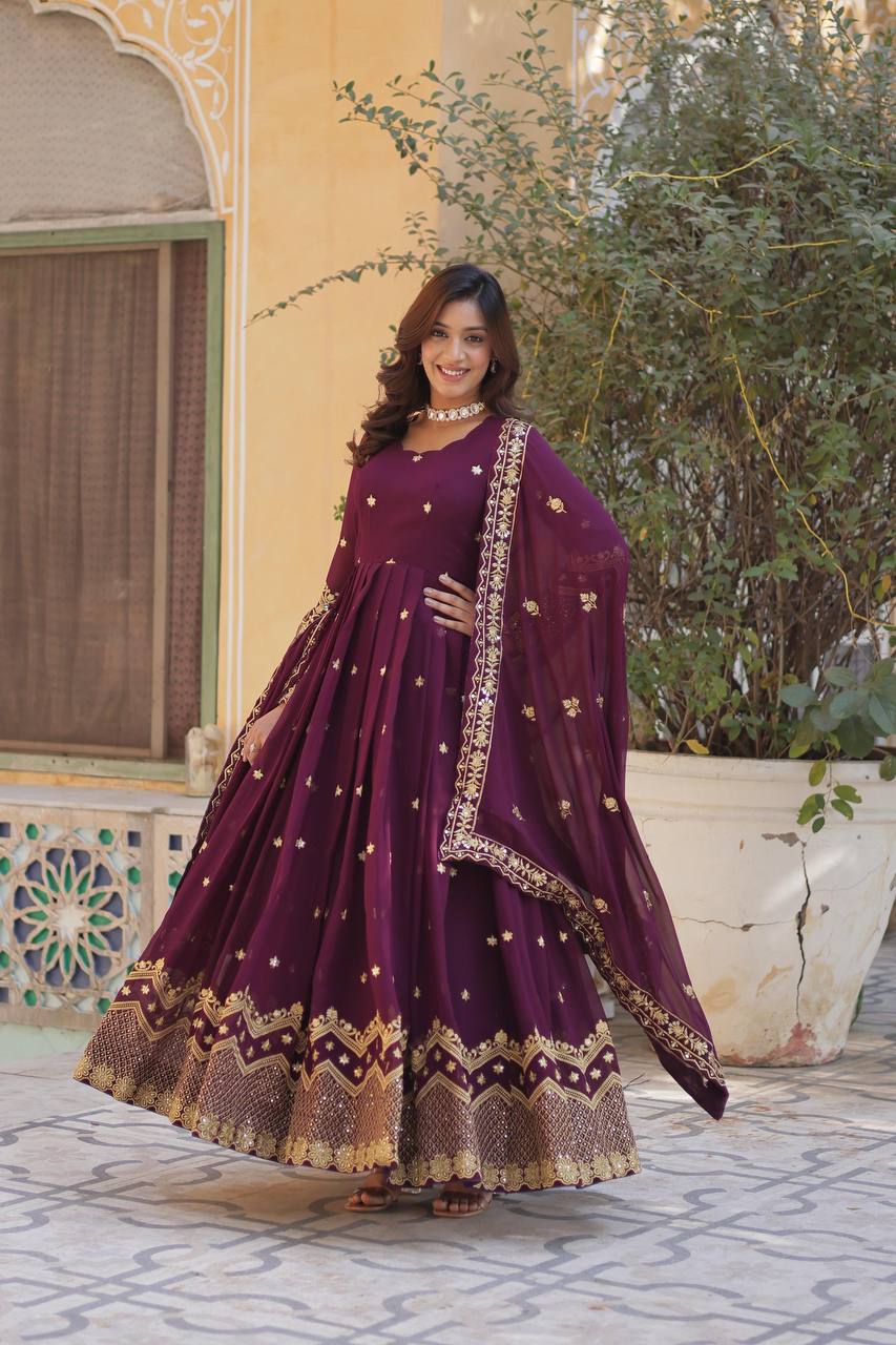 Close-up of a plum embroidered Anarkali gown showing the delicate zari and sequin work.