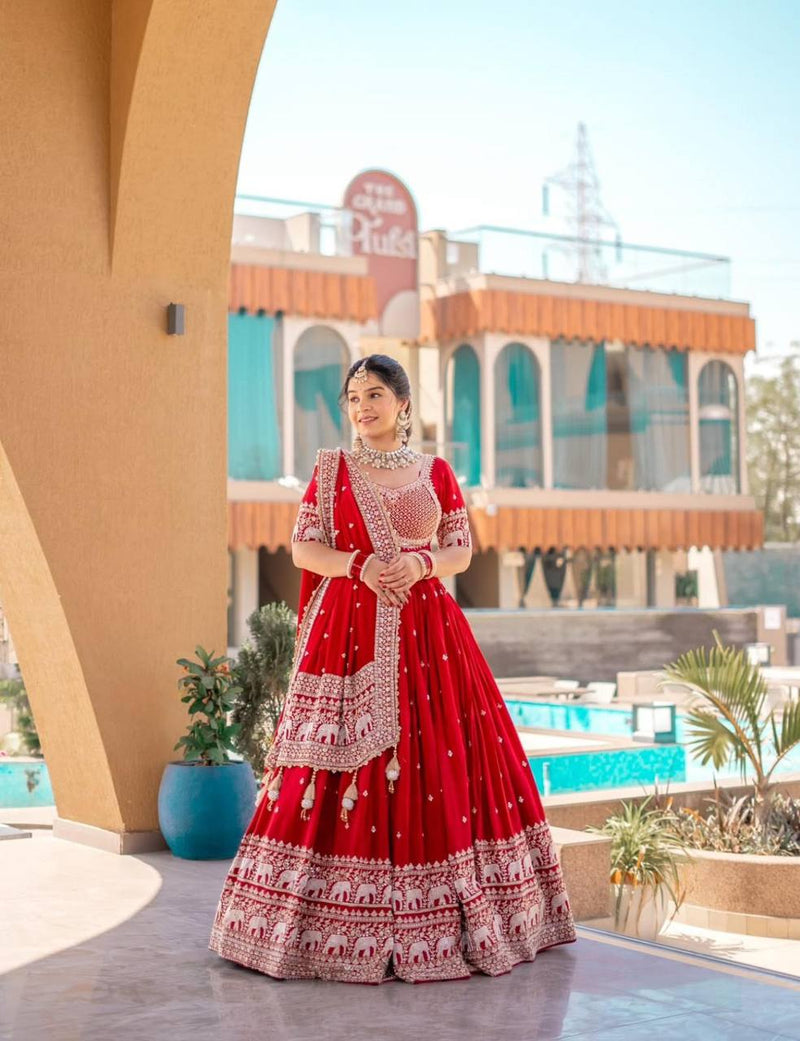 Woman in red embroidered Rangbhoomi Festival Lehenga Choli set.