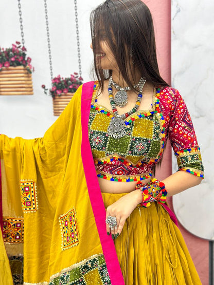 Model in golden Gamthi lehenga set, highlighting artisan blouse and bold accessories.
