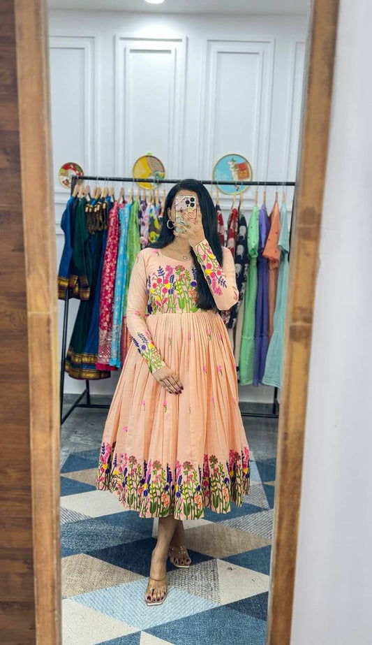 Peach Maska Cotton Dress with floral embroidery, three-quarter sleeves, and pleated skirt.