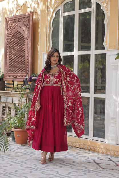 Full view of the pink embroidered gown with dupatta draped over shoulders.
