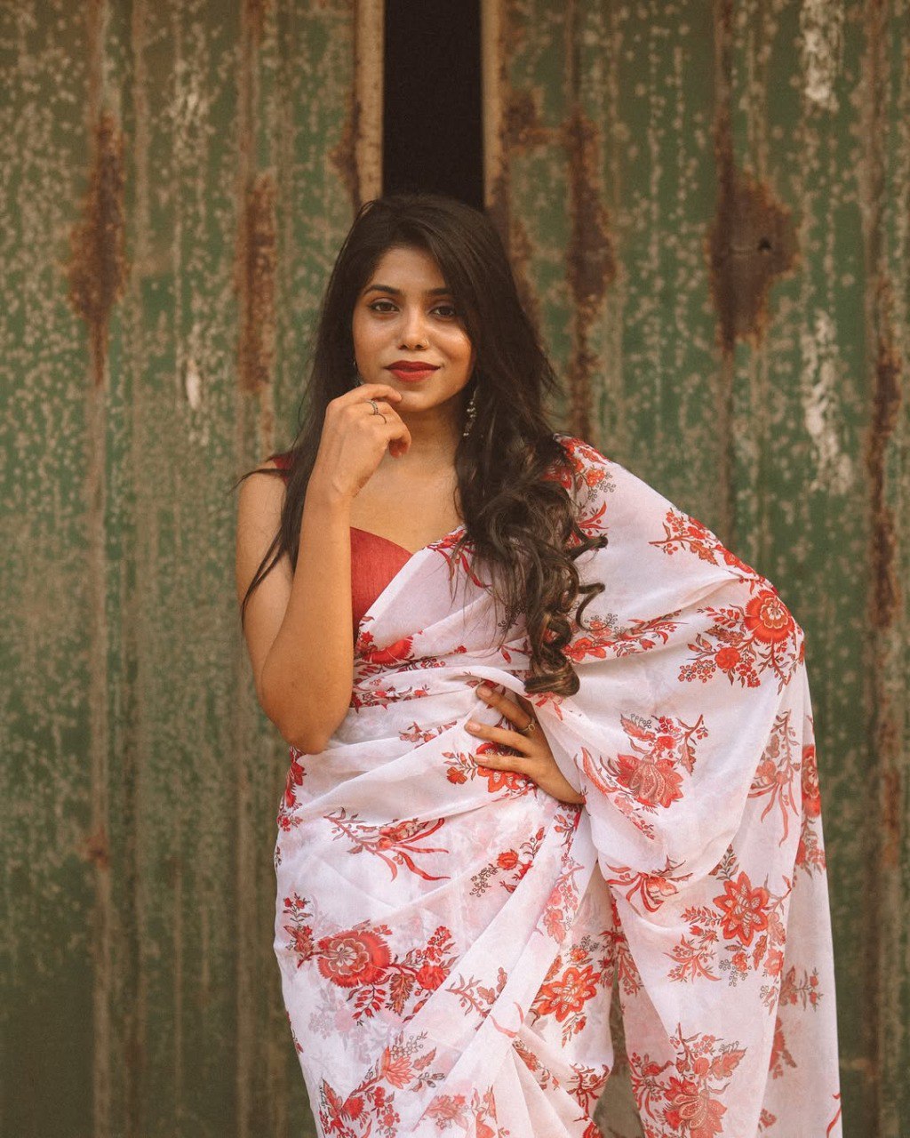 Close-up of off-white floral saree; stylish ethnic wear for festive occasions.