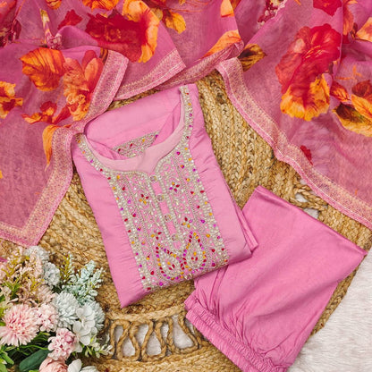 Close up of the embroidered neckline on the pastel pink Anarkali kurta.