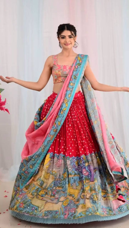Woman wearing Kalamkari Lehenga Choli with dupatta.