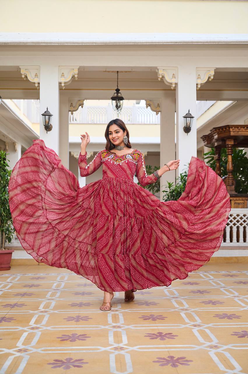 Navratri gown with voluminous flair displayed, highlighting Bandhni pattern and mirror-embellished yoke.