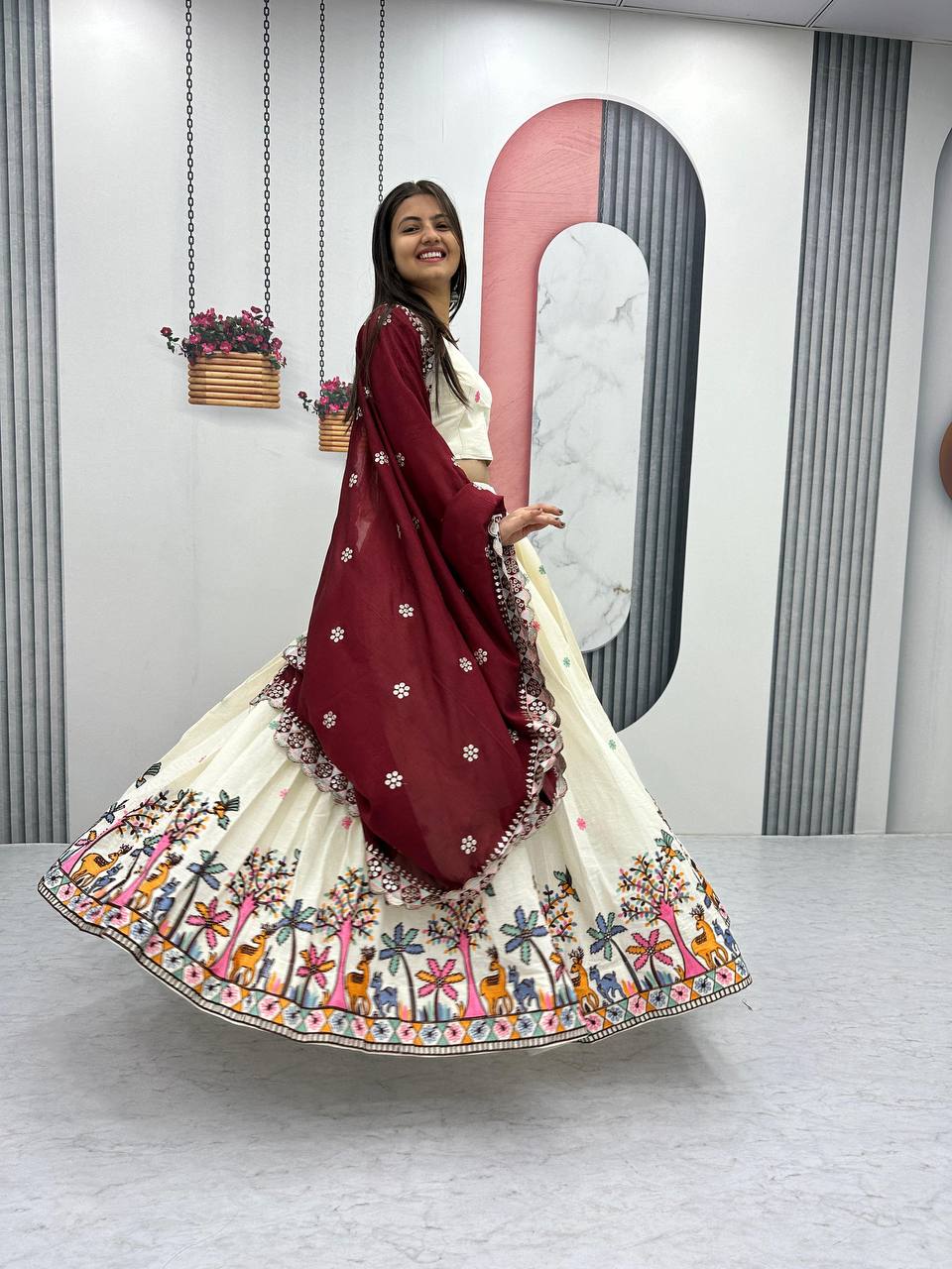 Woman twirling in the Rangbhoomi Lehenga, showing the lehenga's 3.5-meter flair.