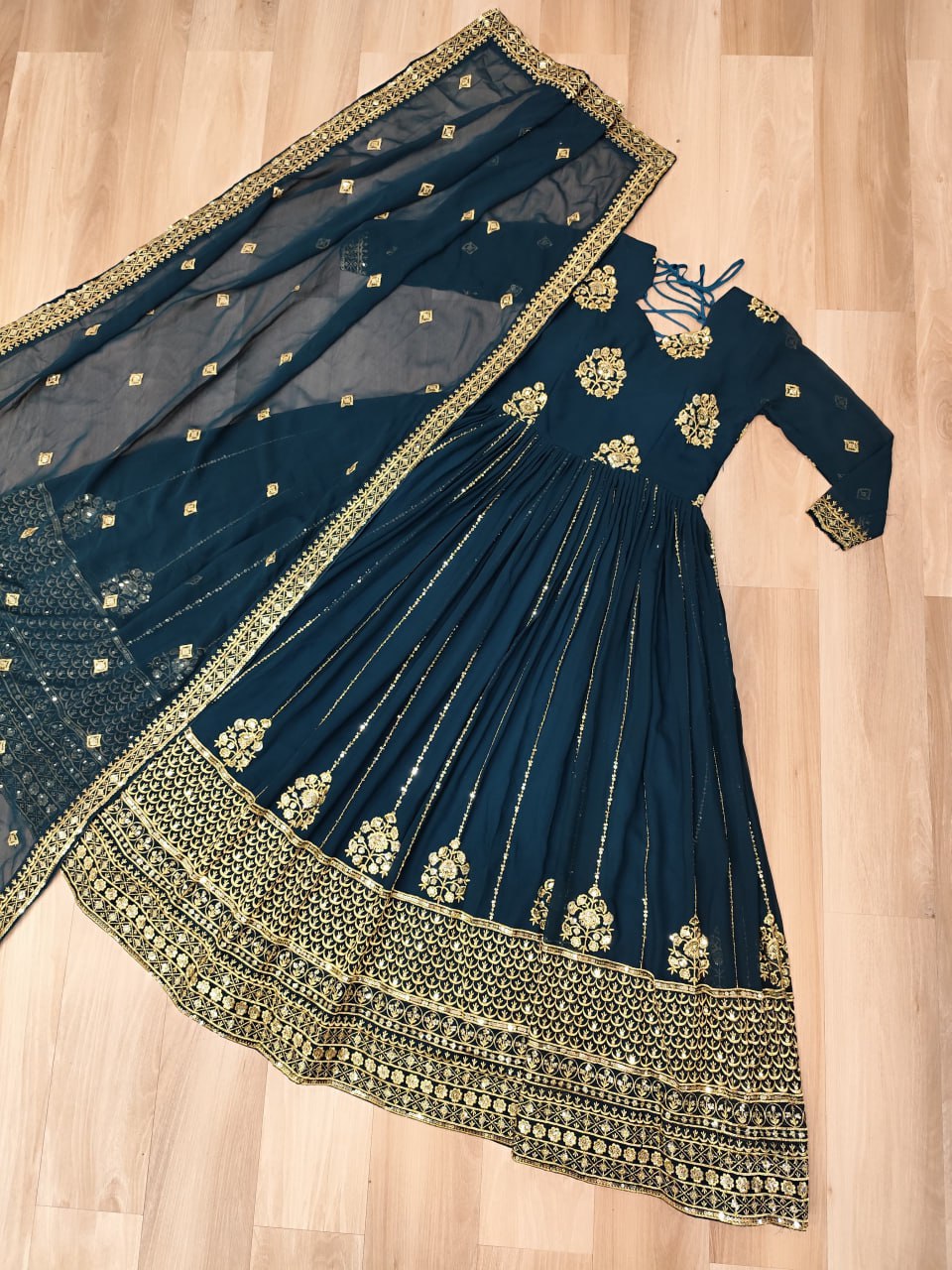 Elegant Rama green gown with zari and sequin embroidery and matching dupatta.